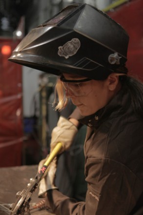 A Bike Bridge project participant works on the piece